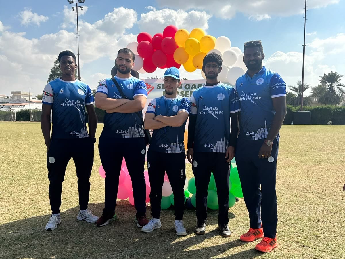 The Wolf Kids coaching team together on the pitch in Dubai.